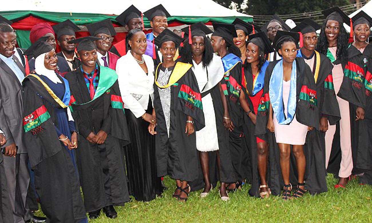 The Minister of State for Youth and Children Affairs, Hon. Florence Nakiwala Kiyingi (Centre) poses with Mastercard Foundation Scholars Programme Graduands of the 69th Graduation Ceremony at a party held on 19th January 2019, Guest House, Makerere University, Kampala Uganda