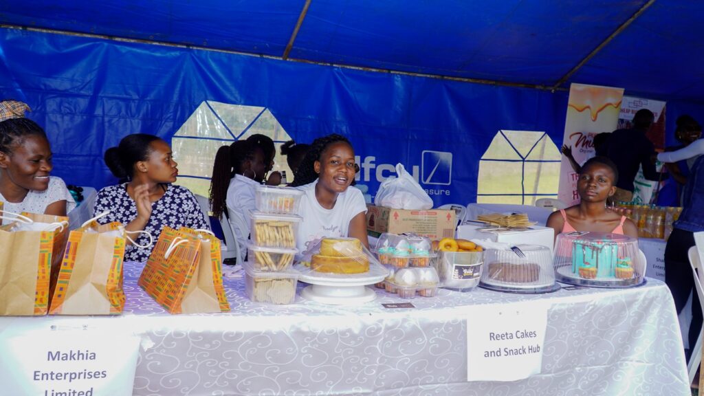 Alumni exhibiting some of the products they were producing through the Scholars Entrepreneurship Fund (SEF) Projects.