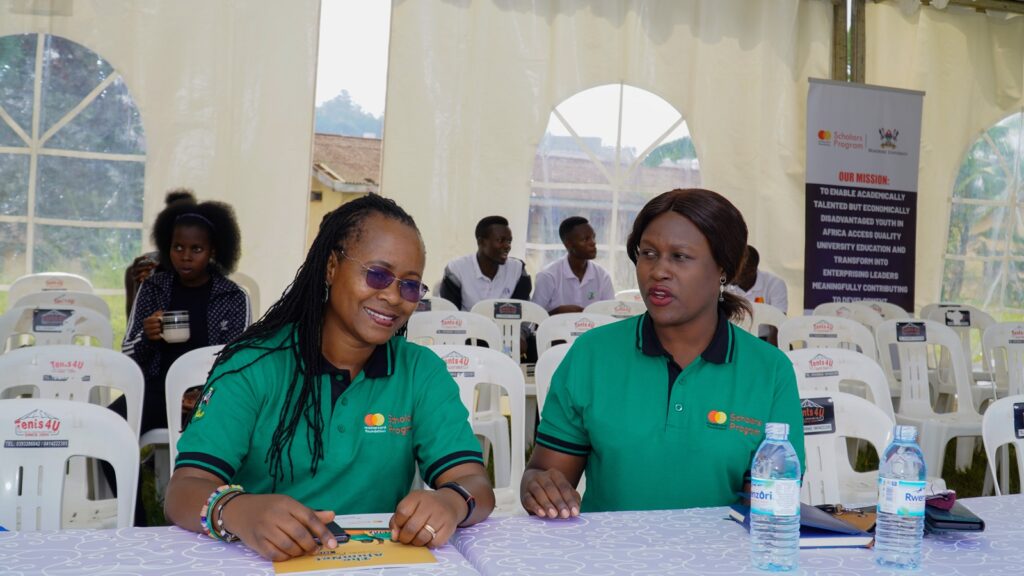 Prof. Sarah Ssali chatting with Ms. Jolly Okumu during the event.