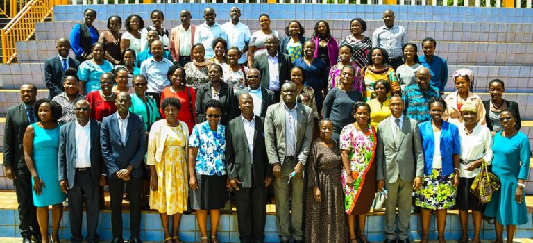 Front Row: Deputy Vice Chancellor (AA) - Dr. Umar Kakumba (4th Right ), Dr. Justine Namaalwa (5th Right ) and FAWE Uganda Chapter ED - Mrs. Susan Opok Tumusiime (3rd Right) join Mak MasterCard Foundation Scholars Program Mentors in a group photo at Hotel Africana on 12th May 2022.