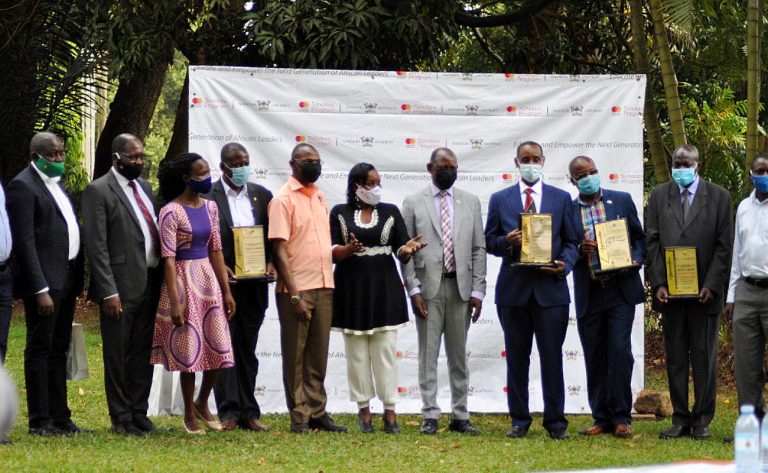 The Vice Chancellor, Prof. Barnabas Nawangwe (5th R) with DVCAA & Chair MCF Steering Committee-Dr. Umar Kakumba (5th L), MCFSP Coordinator-Dr. Justine Namaalwa (6th L) and current as well as former members at the ceremony on 19th December 2020, Makerere University Guest House.